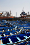 Morocco / Maroc - Mogador / Essaouira: huge fleet of blue fishing boats - photo by M.Ricci