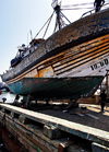 Morocco - Essaouira: port - trawler undergoing repairs - photo by M.Ricci