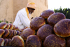 Agadir, Morocco: market - buying bread - photo by Sandia