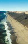 Namibia: Aerial view of Skeleton Coast - Ocean meets Sand dunes - looking north, Kunene region - photo by B.Cain