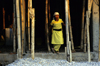 Nepal - Pokhara: female worker at a construction site - bamboo scaffolding - photo by W.Allgwer