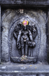 Kathmandu, Nepal: stone sculpture of the Hindu god Shiva - he embodies the principle of destruction - part of the Hindu Trinity (Trimurti) with the three aspects of the divine as Brahma, the creator, and Vishnu, the custodian - photo by W.Allgwer