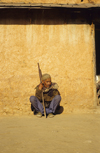 Kathmandu valley, Nepal: Newari man sitting on the ground - photo by W.Allgwer