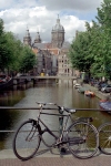 Netherlands / Holland - Amsterdam / Amesterdo: entering the Red Light District - quintessential Amsterdam - bike, canal and St Nicholas church - bicicleta (photo by M.Bergsma)