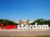 Netherlands / Holland  - Amsterdam: leaning on the canal - view from the Damrak - back of Warmoesstraat - background: Oude Kerk - photo by D.Hicks