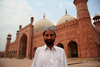 Lahore, Punjab, Pakistan: Pakistan - Punjab - Lahore - man in front of Badshahi mosque - photo by G.Koelman