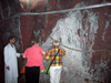 Jhelum District, Punjab, Pakistan: Khewra Salt Mines - tourists and wall of almost pure Sodium chloride - photo by D.Steppuhn