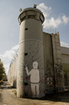 near Bethlehem, , West Bank, Palestine: graffitti on watchtower - breaking the wall with a single finger - hafrada fence - photo by J.Pemberton