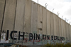 near Bethlehem, West Bank, Palestine: graffitti on Wall - Kennedy's 'Ich bin ein Berliner' - which can mean 'I am a doughnut' - concrete slabs of the separation fence - photo by J.Pemberton