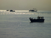 Panama City: fishing boats silhouetted against the morning sky - photo by H.Olarte