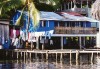Panama - Bastimentos Island / isla Bastimentos: house over the water / casa sobre agua -  Bocas del Toro Islands - photo by G.Frysinger