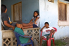 Three kids smile for the camera in Portobello, Coln, Panama, Central America - photo by H.Olarte