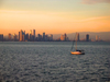 Panama City: seen from the Pacific Ocean - sailboat with skyline as background - photo by H.Olarte
