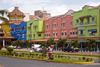 Coln, Panama: Colon 2000 cruise ship terminal, Colon City - colourful faades and jogger - photo by H.Olarte