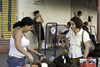 Santiago de Veraguas, Panama: a produce vendor speaks with a customer at El Mosquero market - photo by H.Olarte