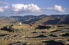 Cuzco, Peru: people sit on the foundation of Muyucmarca, one of Sacsayhuaman's three great towers - view of the mountains - photo by C.Lovell