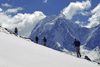 Ausangate massif, Cuzco region, Peru: trekkers head towards Campa Pass while enjoying a great view of Tres Picos - Peruvian Andes - photo by C.Lovell