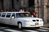 Lima, Peru: GAZ Volga limo brings a bride to her wedding - Archbishop's palace in the background - photo by M.Torres