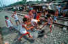 Manila city, Philippines - children play with an old matress - Slums and shanty towns - photo by B.Henry