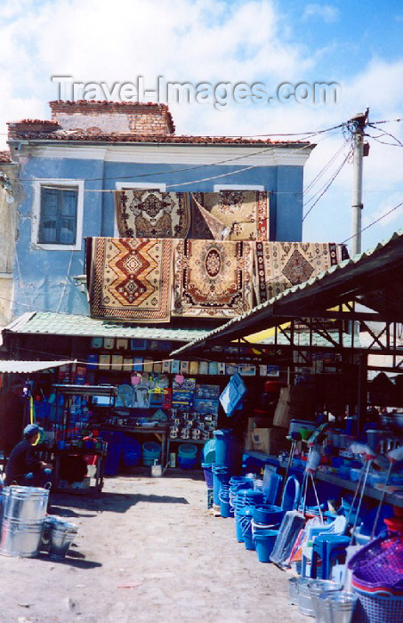 albania24: Albania / Shqiperia - Korçë / Korça / Korce: selling carpets and rugs - bazaar scene - photo by M.Torres - (c) Travel-Images.com - Stock Photography agency - Image Bank