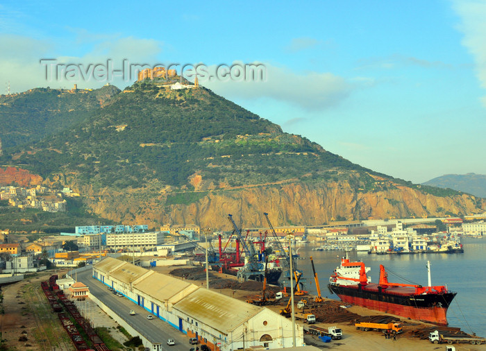 algeria188: Oran, Algeria / Algérie: harbor - Bassin d'Arzew - the freighter Artic Stream with Djebel Murdjadjo mountain in the background - photo by M.Torres | le port - Bassin d'Arzew - le navire cargo Arctic Stream avec la montagne Djebel Murdjadjo en fond - (c) Travel-Images.com - Stock Photography agency - Image Bank