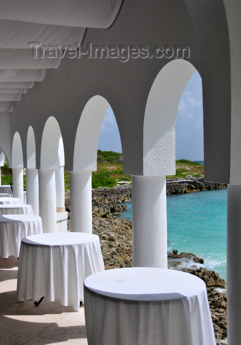 anguilla16: Maundays Bay, West End Village, Anguilla: empty tables by the sea - arcade at Cap Juluca five-star resort - photo by M.Torres - (c) Travel-Images.com - Stock Photography agency - Image Bank