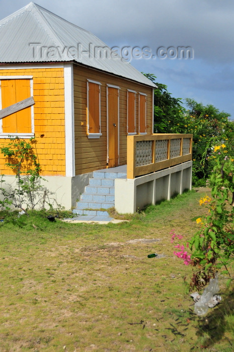 anguilla42: The Valley, Anguilla: orange cottage with zinc roof - Carribbean dwelling, Anguillean charm - photo by M.Torres - (c) Travel-Images.com - Stock Photography agency - Image Bank