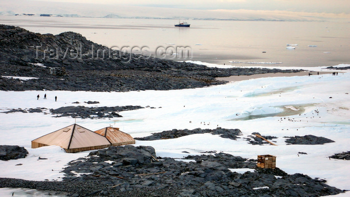 antarctica25: Commonwealth Bay, East Antarctica: view of Cape Denison - Mawson's Huts, maintained by Australian Antarctic Division; Mawson's Huts Foundation - Spirit of Enderby in background - photo by R.Eime - (c) Travel-Images.com - Stock Photography agency - Image Bank