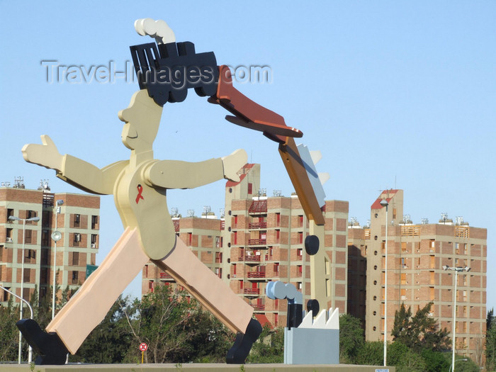 argentina194: Argentina - Córdoba - modern art - statue with AIDS ribbon against residential blocks - images of South America by M.Bergsma - (c) Travel-Images.com - Stock Photography agency - Image Bank