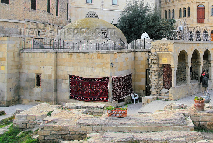 azer101: Azerbaijan - Baku / Baki: old town - carpet dealer by the Hadji Haib baths - photo by Miguel Torres - (c) Travel-Images.com - Stock Photography agency - Image Bank