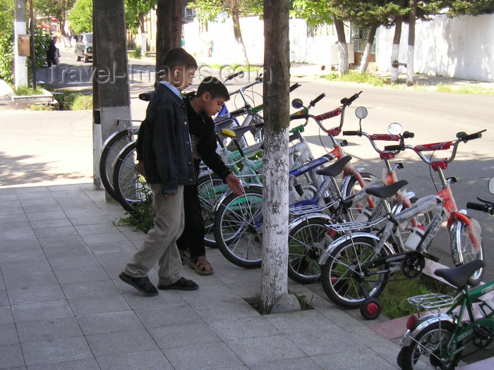 azer233: Azerbaijan - Lankaran / Lenkoran: choosing a bike (photo by F.MacLachlan) - (c) Travel-Images.com - Stock Photography agency - Image Bank