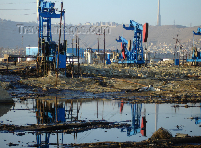 azer428: Baku - Azerbaijan: oil contamindated soil and pumpjacks near the harbour, below Bibi Heybat Mosque - pollution - photo by F.MacLachlan - (c) Travel-Images.com - Stock Photography agency - Image Bank