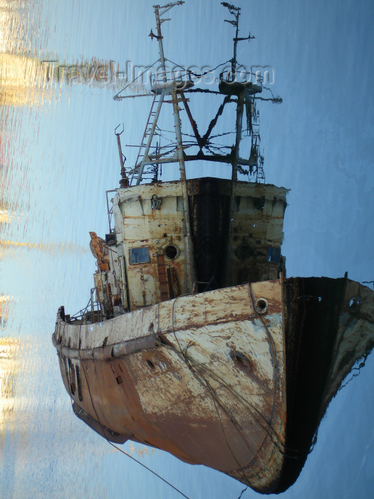 azer429: Baku - Azerbaijan: a ghost boat rests on its portside - reflection - area of 'port' just beyond Bibi Heybat Mosque - photo by F.MacLachlan - (c) Travel-Images.com - Stock Photography agency - Image Bank