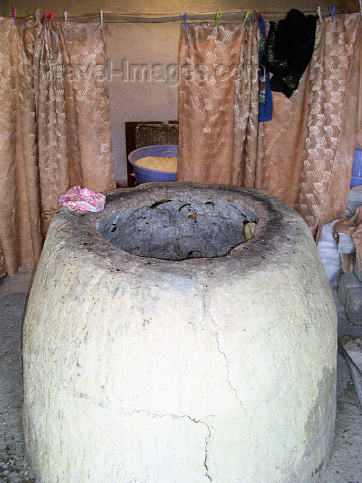 azer524: Baku, Azerbaijan: tendir oven - cylindrical clay oven powered by charcoal - tandoor - photo by G.Monssen - (c) Travel-Images.com - Stock Photography agency - Image Bank