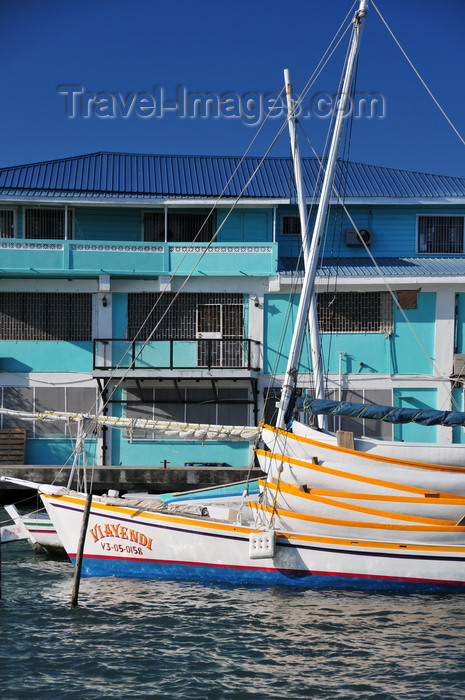 belize111: Belize City, Belize: mouth of Haulover Creek - house and boat Viayendi loaded with canoes - photo by M.Torres - (c) Travel-Images.com - Stock Photography agency - Image Bank