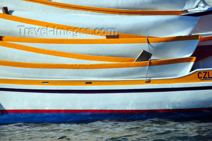 belize112: Belize City, Belize: mouth of Haulover Creek - pile of canoes and the hull of the Viayendi - photo by M.Torres - (c) Travel-Images.com - Stock Photography agency - Image Bank