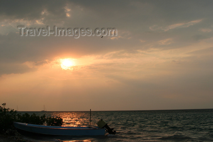 belize60: Belize - Seine Bight, Placencia peninsula, Stann Creek District: boat at sunset - photo by Charles Palacio - (c) Travel-Images.com - Stock Photography agency - Image Bank