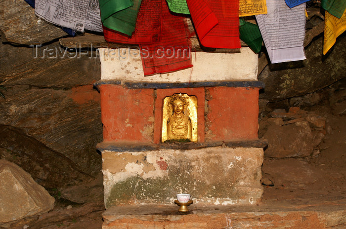 bhutan139: Bhutan - Paro dzongkhag - Golden figure and prayer flags, outside Taktshang Goemba - photo by A.Ferrari - (c) Travel-Images.com - Stock Photography agency - Image Bank