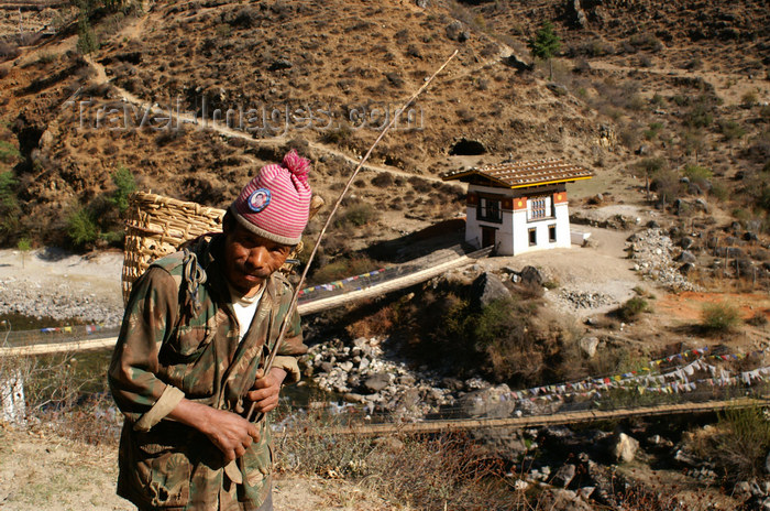 bhutan142: Bhutan - Old man near Tamchhog Lhakhang - bridge in the background - photo by A.Ferrari - (c) Travel-Images.com - Stock Photography agency - Image Bank