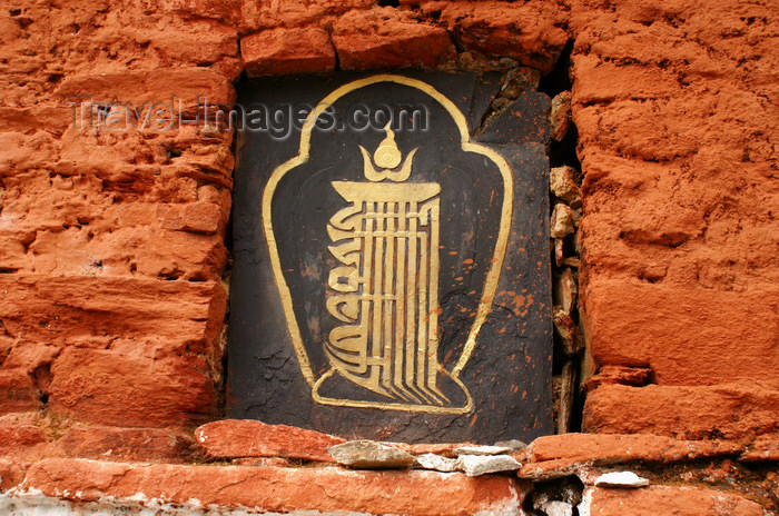 bhutan310: Bhutan - Buddhist symbol in the main wall of the Chendebji Chorten - photo by A.Ferrari - (c) Travel-Images.com - Stock Photography agency - Image Bank