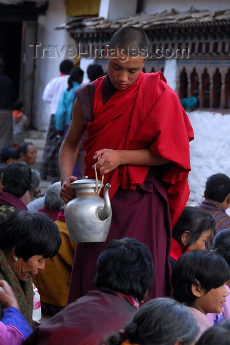 bhutan414: Bhutan, Paro, a monk distributes tea to pilgrims - photo by J.Pemberton - (c) Travel-Images.com - Stock Photography agency - Image Bank