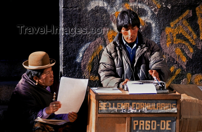 bolivia130: La Paz, Bolivia: street scribe types a letter for an illeterate Aymara woman - photo by C.Lovell - (c) Travel-Images.com - Stock Photography agency - Image Bank