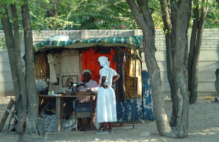 botswana28: Maun, North-West District, Botswana: local tailor using her sewing machine al-fresco - photo by J.Banks - (c) Travel-Images.com - Stock Photography agency - Image Bank