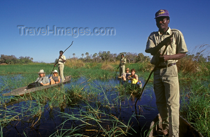 botswana67: Okavango delta, North-West District, Botswana: makoro canoes glide through the shallow waters with the help of poles - mokoro safari - punting - photo by C.Lovell - (c) Travel-Images.com - Stock Photography agency - Image Bank