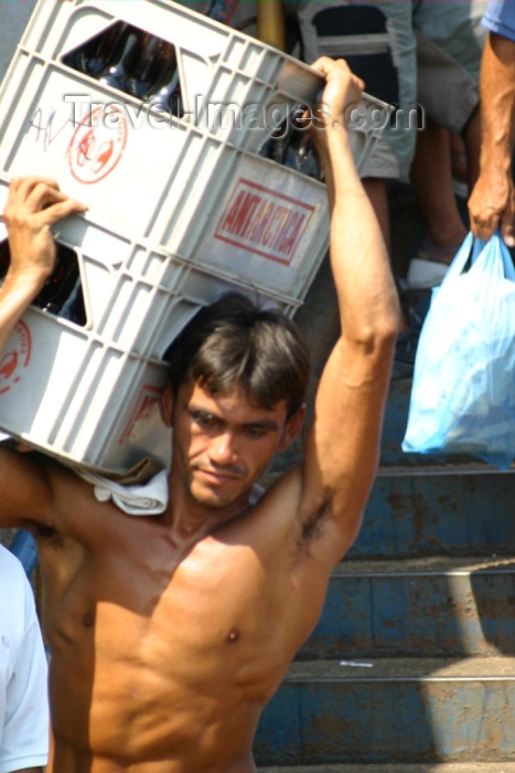 brazil178: Brazil / Brasil - Manaus: loading boxes - Antarctica beer - muscular man - carregando grades de cerveja Antarctica  (photo by N.Cabana) - (c) Travel-Images.com - Stock Photography agency - Image Bank