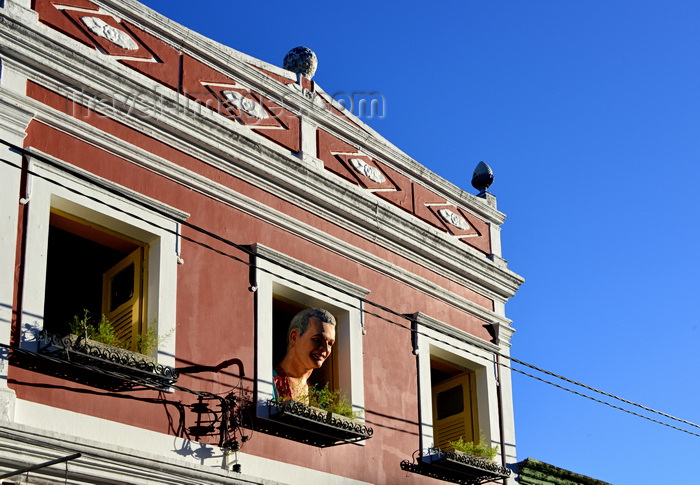 brazil522: Olinda, Pernambuco, Brazil: red façade with three open windows and man's bust in the center - Rua 27 de Janeiro - photo by M.Torres - (c) Travel-Images.com - Stock Photography agency - Image Bank