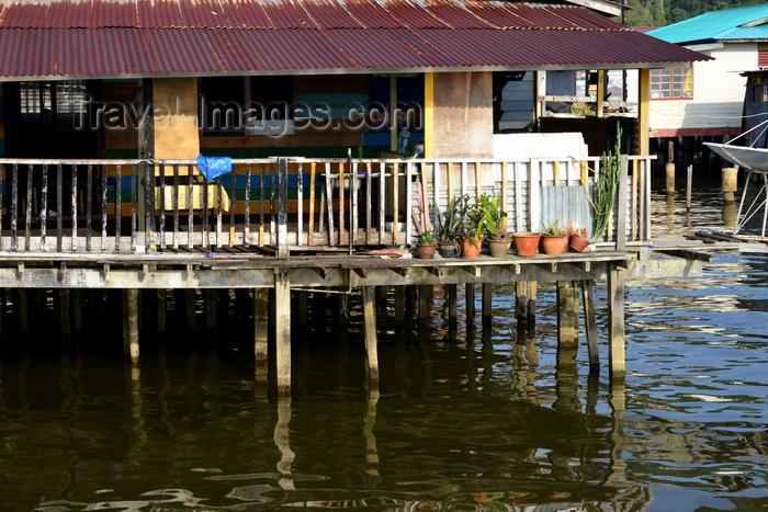 brunei104: Bandar Seri Begawan, Brunei Darussalam: Kampong Ayer water village - palafitte's balcony on the water - photo by M.Torres - (c) Travel-Images.com - Stock Photography agency - Image Bank
