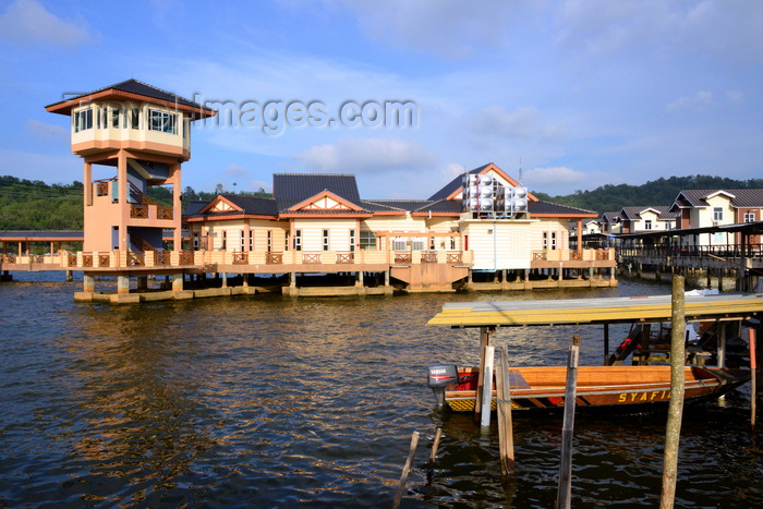 brunei106: Bandar Seri Begawan, Brunei Darussalam: moored boat and visitors' center tower at Kampung Ayer water village - photo by M.Torres - (c) Travel-Images.com - Stock Photography agency - Image Bank