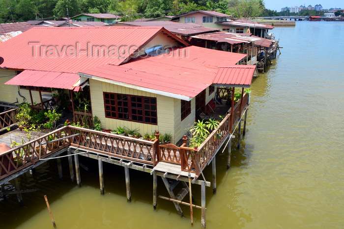 brunei30: Bandar Seri Begawan, Brunei Darussalam: red roofed buildings of Kampong Ujong Bukit water village - photo by M.Torres - (c) Travel-Images.com - Stock Photography agency - Image Bank