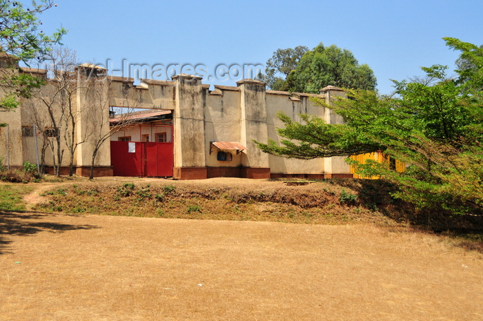 burundi65: Gitega / Kitega, Burundi: old German fort - red gate and acacia - photo by M.Torres - (c) Travel-Images.com - Stock Photography agency - Image Bank